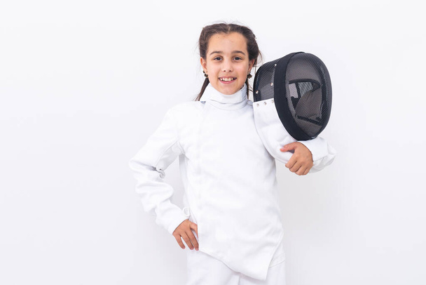 Little girl fencer with epee and mask. - Photo, image