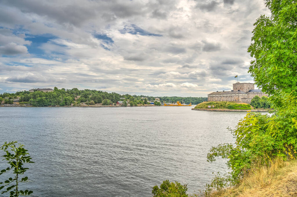 Vaxholm, Sweden - August 2022 : Picturesque island village in cloudy weather, HDR Image - Photo, Image