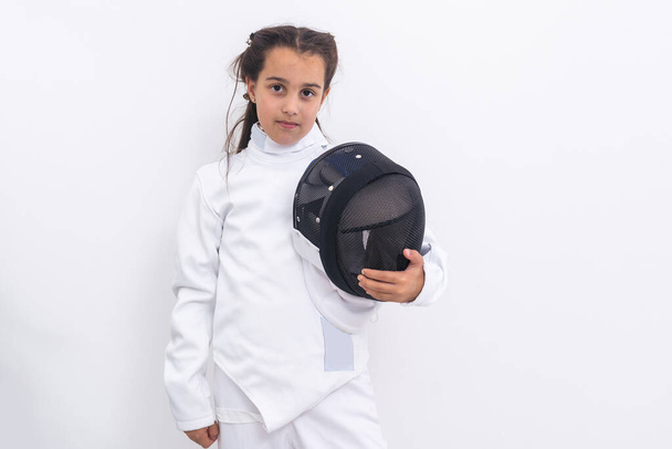 Little girl fencer with epee and mask. - Photo, image