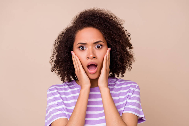 Closeup photo of young attractive nice girl wear striped t-shirt open mouth funny face reaction breaking news isolated on beige color background. - Foto, Imagem