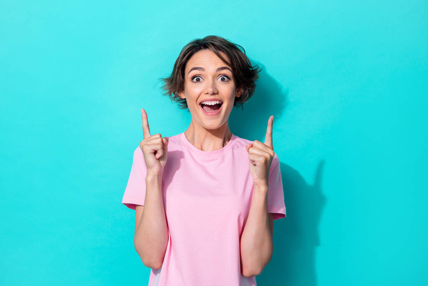 Photo of hooray short hairdo millennial lady index up wear pink t-shirt isolated on turquoise color background. - Foto, afbeelding