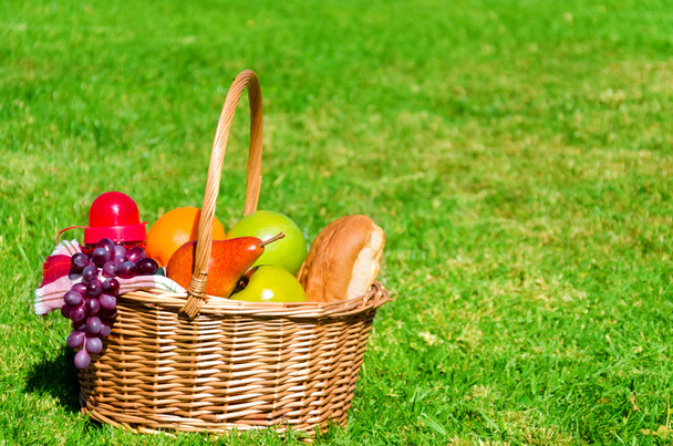 Picnic basket with fruits  - Photo, image