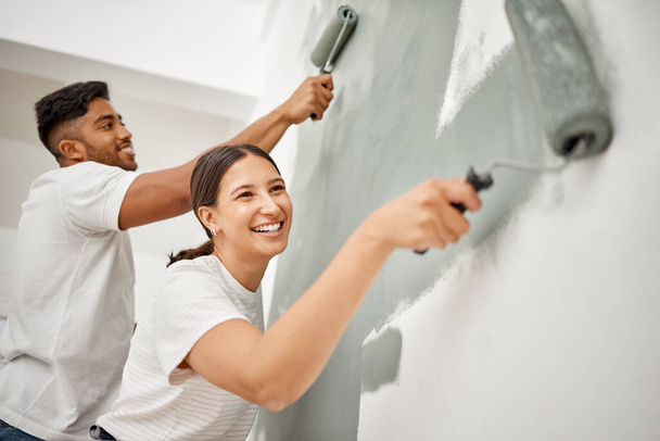 We just moved in and already renovating. a young couple painting a room together - 写真・画像