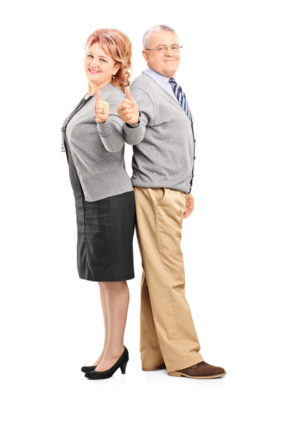 Mature couple giving thumbs up - 写真・画像