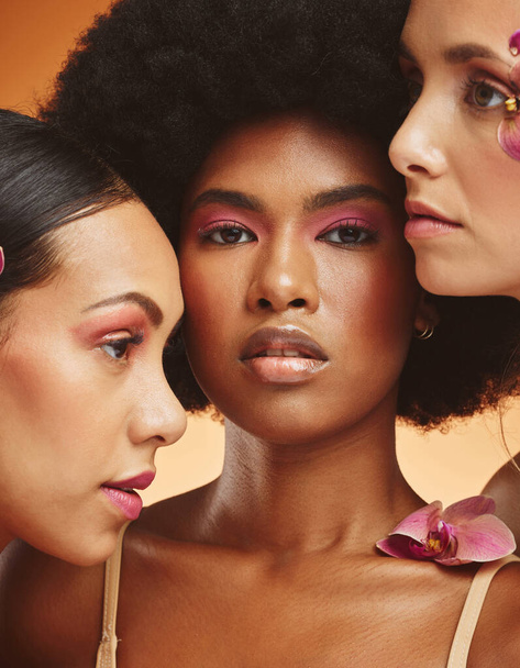 Beauty, flower and group of women with makeup in studio, model for fashion, cosmetics and skincare. Diversity, beauty products and portrait of African girls face for spa, skincare and skin wellness. - Photo, Image