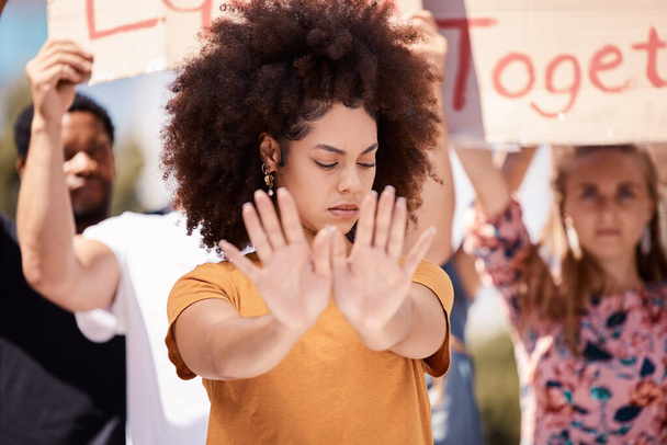 Protest, stop and hands of black woman with people in street for equality, freedom and human rights. Justice, community and group of activist on road in city for black lives matter and social change. - Photo, image