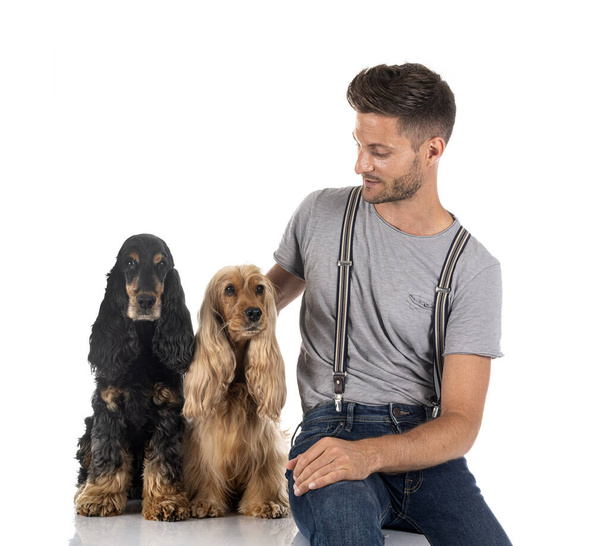 English Cocker Spaniel and owner in front of white background - Photo, image