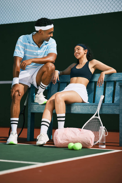 Big leagues baby. two tennis players bonding while sitting together after a match of tennis - 写真・画像