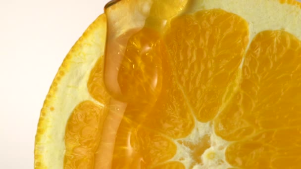 Leje się miód na pomarańczowo - Materiał filmowy, wideo