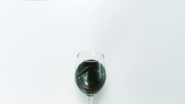 Red wine splashing out of glass - Footage, Video