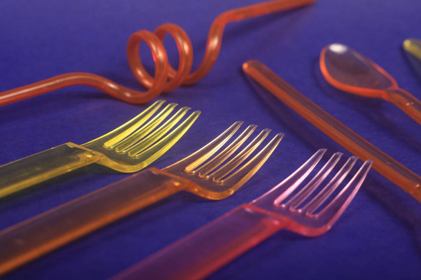 a closeup shot of a fork and a knife on a blue background - Photo, Image