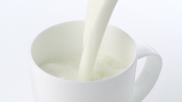 Pouring milk into mug - Footage, Video