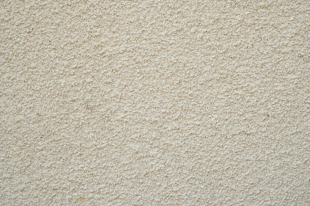 Textured beige plaster on the wall.. - Photo, Image