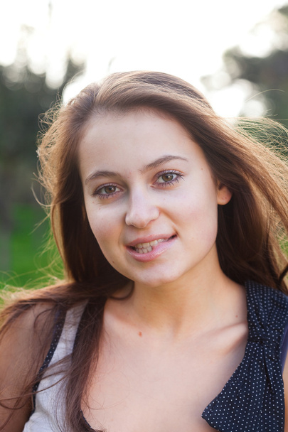 Portrait of a beautiful young woman outdoor - Photo, Image
