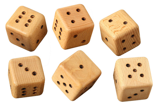 Playing dice on a light background. Dice handmade from wood. - Photo, Image