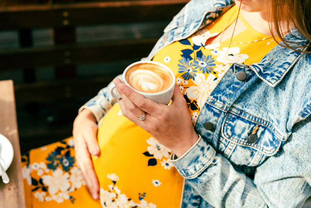 Pregnant woman coffee drink. Lifestyle morning with happy pregnancy girl drink espresso coffee. Represent breakfast, energy, freshness or great aroma concept - Φωτογραφία, εικόνα