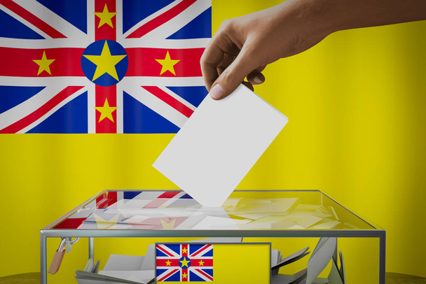 Niue vlag, hand laten vallen stemkaart in een doos - stemming, verkiezingsconcept - 3D illustratie - Foto, afbeelding