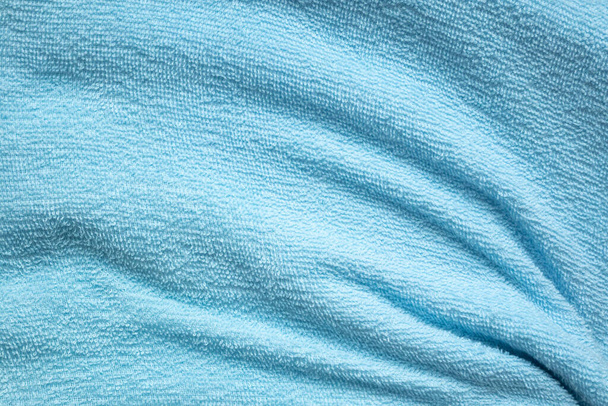 Текстура полотенца из голубой хлопчатобумажной ткани - Фото, изображение