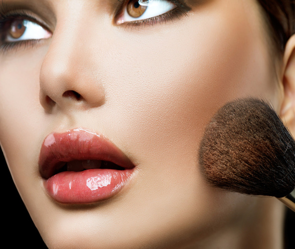 Girl and Makeup applying. - Foto, afbeelding
