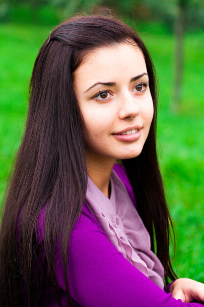 Portrait of a beautiful young woman outdoor - Photo, image