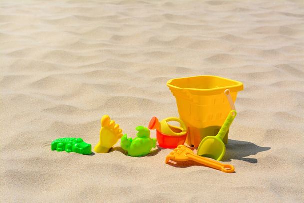 Set of colorful beach toys on sand - Fotografie, Obrázek