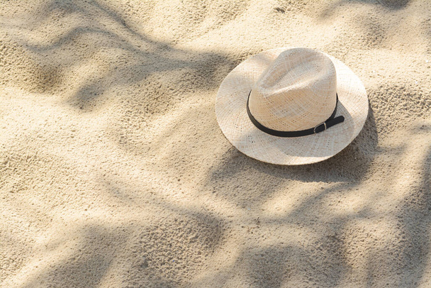 Stylish straw hat on sand outdoors, space for text - Φωτογραφία, εικόνα