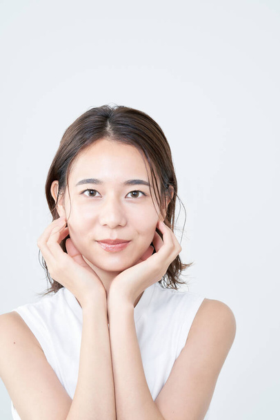 portrait of asian young woman and white background - Photo, Image