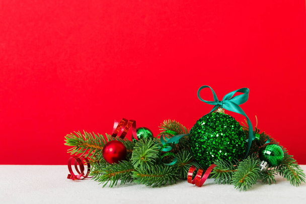 New Year Christmas tree toy, branches of a christmas tree, New Year decorations on a colored background. - Photo, image