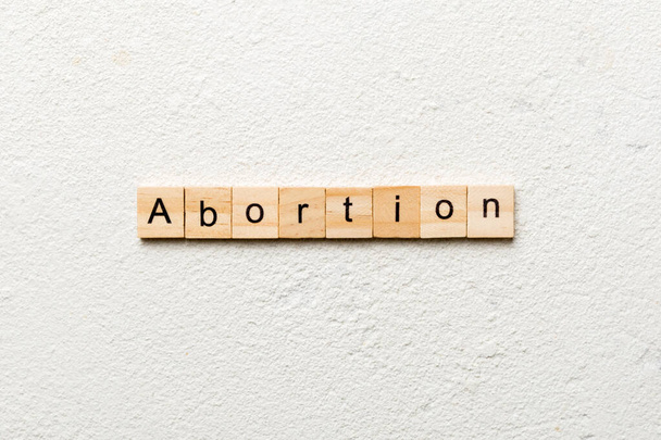 abortion word written on wood block. abortion text on table, concept. - Фото, изображение