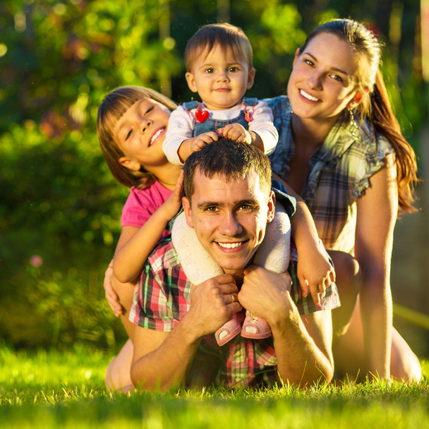 Family having fun outdoors in summer. - Φωτογραφία, εικόνα