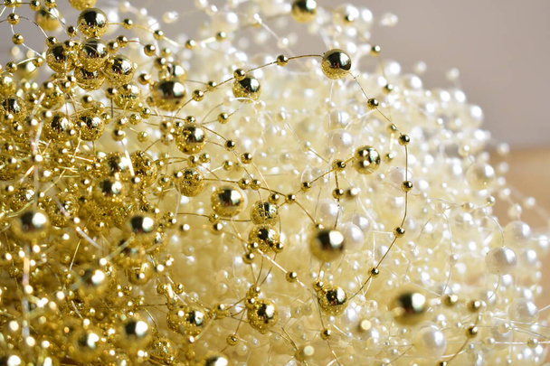 Sparkle twinkle glitter golden pearl string, jewelry handmade background - Fotó, kép