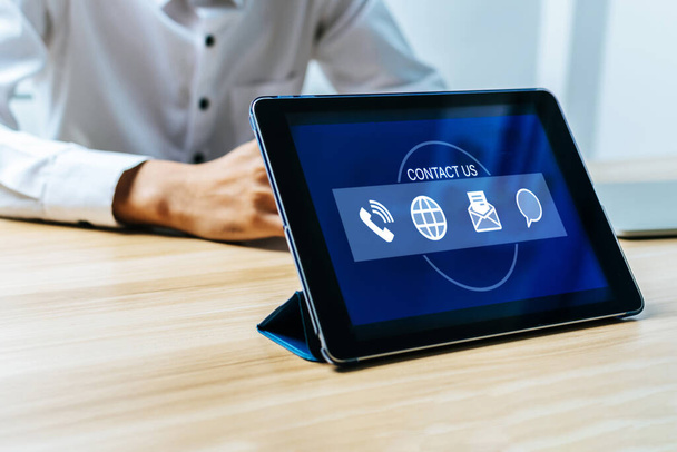 Contact Us. digital mobile tablet with business finance icon on desk, business management, team leader, human resource, job interview, company growth, market trend, finance, business start up concept - Fotografie, Obrázek