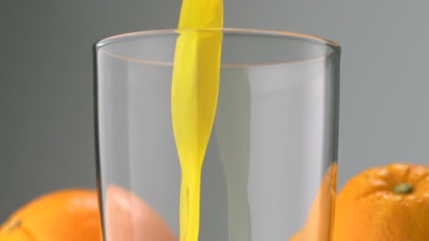 Pouring orange juice into glass - Footage, Video