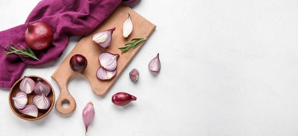 Composition with red onion on white background with space for text, top view - Photo, Image