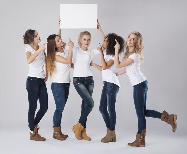 Women holding empty white board - 写真・画像