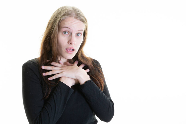 young woman hands on chest surprised face offended with open mouth long blond hair on white background - Photo, Image
