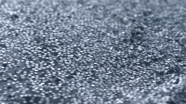 Golven in water gevuld met glitters - Video