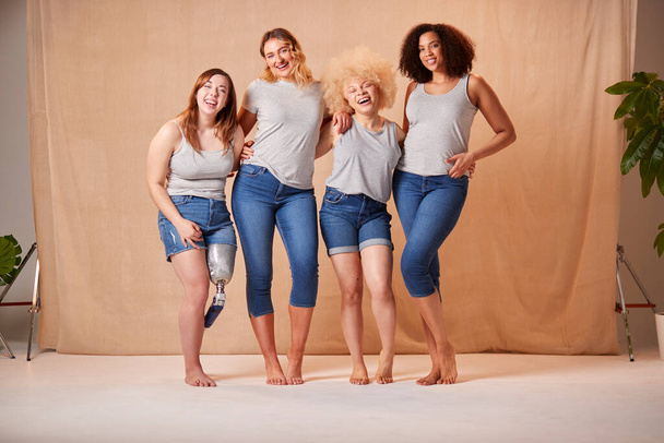 Group Of Diverse Casually Dressed Women Friends One With Prosthetic Limb Promoting Body Positivity - 写真・画像