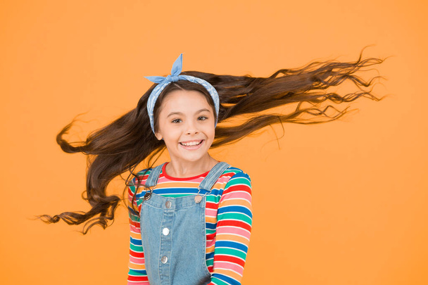 female hairdresser. happy retro kid wear colorful clothes. casual denim fashion. carefree summer for joy. hairstyle accessory trends. optimistic hipster child. Young and carefree small girl. - 写真・画像