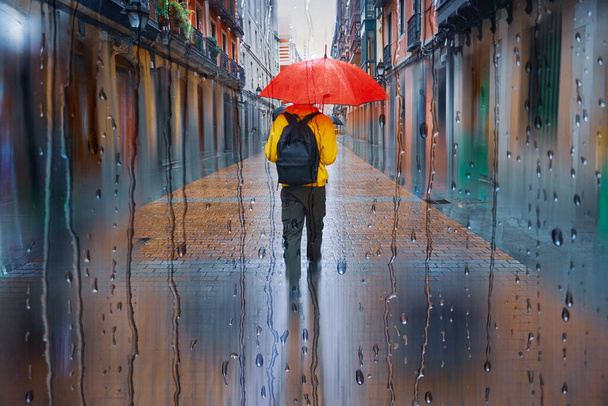 people with an umbrella in rainy days, bilbao, basque country, spain - Photo, image