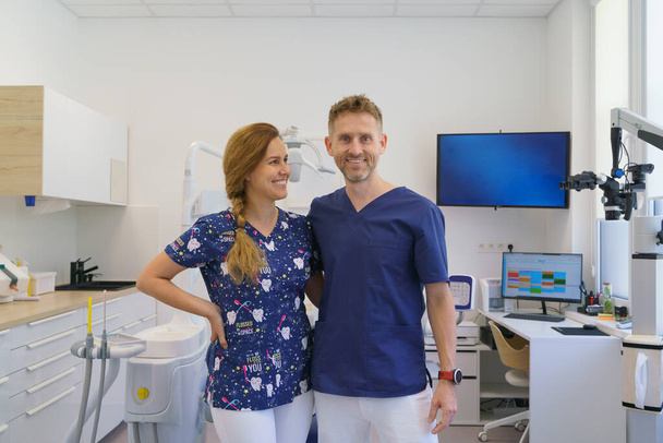 Dentist posing with a nurse in dentists ambulance. - Zdjęcie, obraz