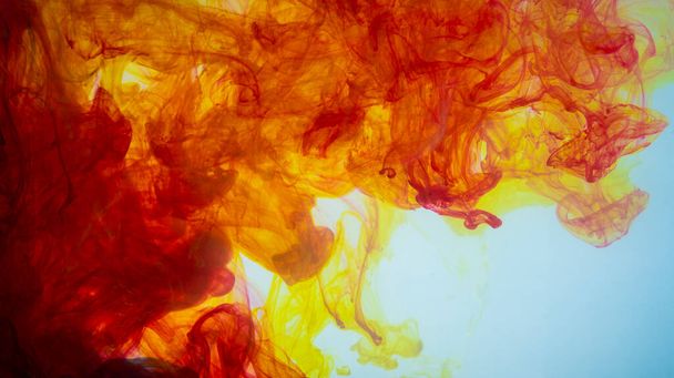 Yellow and red paint making abstract art wallpaper in white. - Foto, immagini
