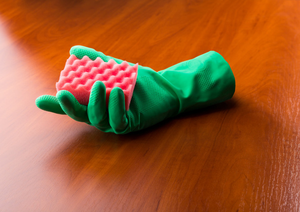 Green cleaning glove with a sponge  - Фото, изображение