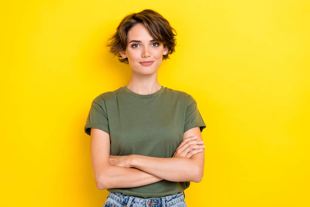 Photo of girlish pretty confident nice girl with bob hairstyle wear khaki t-shirt arms crossed isolated on yellow color background. - Φωτογραφία, εικόνα