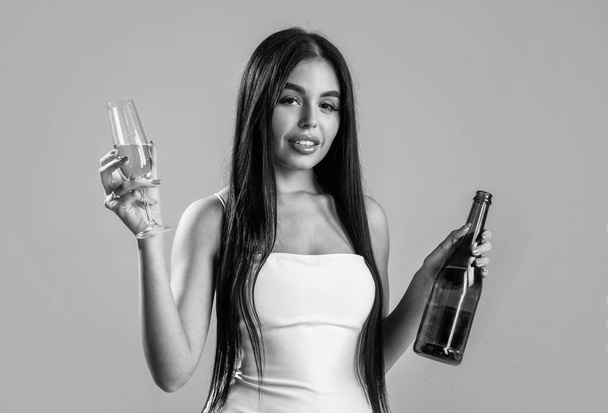 sexy woman drinking champagne from glass, celebrate. - Zdjęcie, obraz