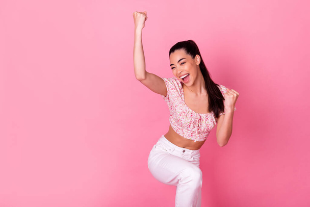Photo of delighted overjoyed filipino lady raise fists achievement luck isolated on pink color background. - Φωτογραφία, εικόνα
