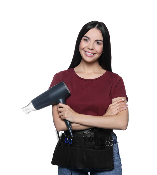 Portrait of happy hairdresser with hairdryer on white background - Фото, изображение
