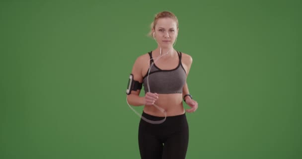 White woman casually running toward the camera on green screen. On green screen to be keyed or composited. - Footage, Video