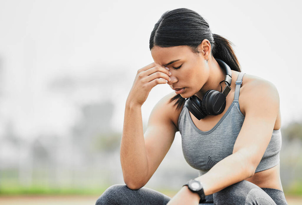 Shes not where she wants to be. an attractive young female athlete looking stressed while exercising outside - Photo, Image