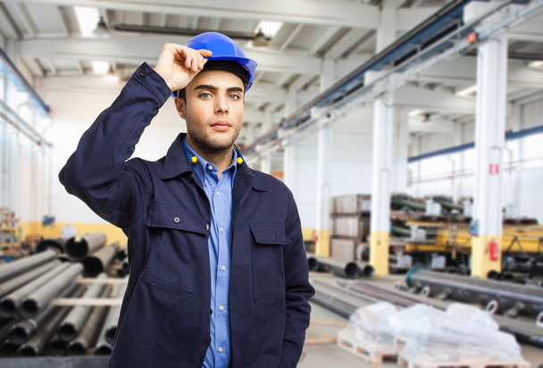 Portrait of a worker in a factory - Foto, Bild